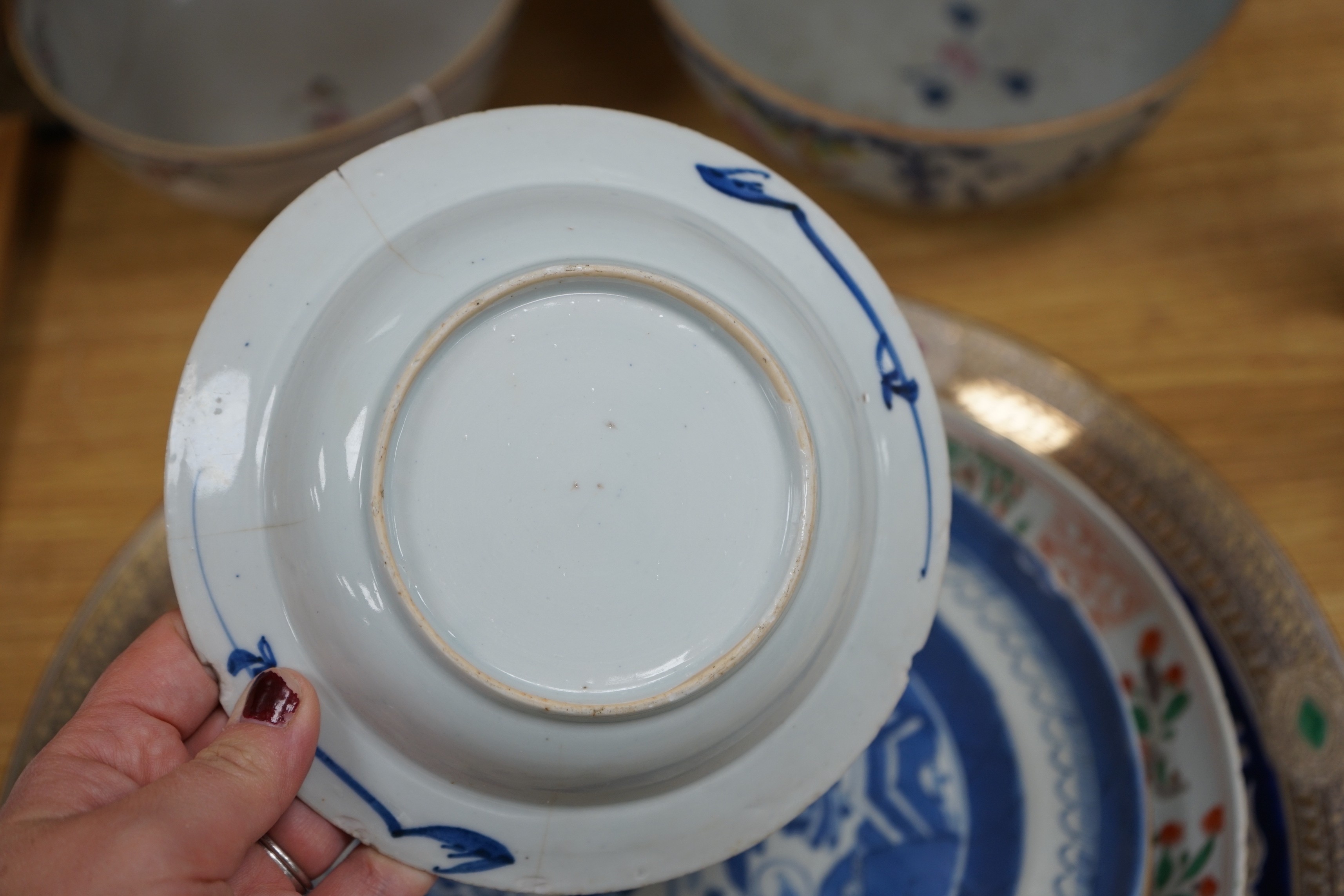 A group of 18th century and later Chinese enamelled and blue and white porcelain dishes and three bowls, Largest dish 35.5 cm diameter